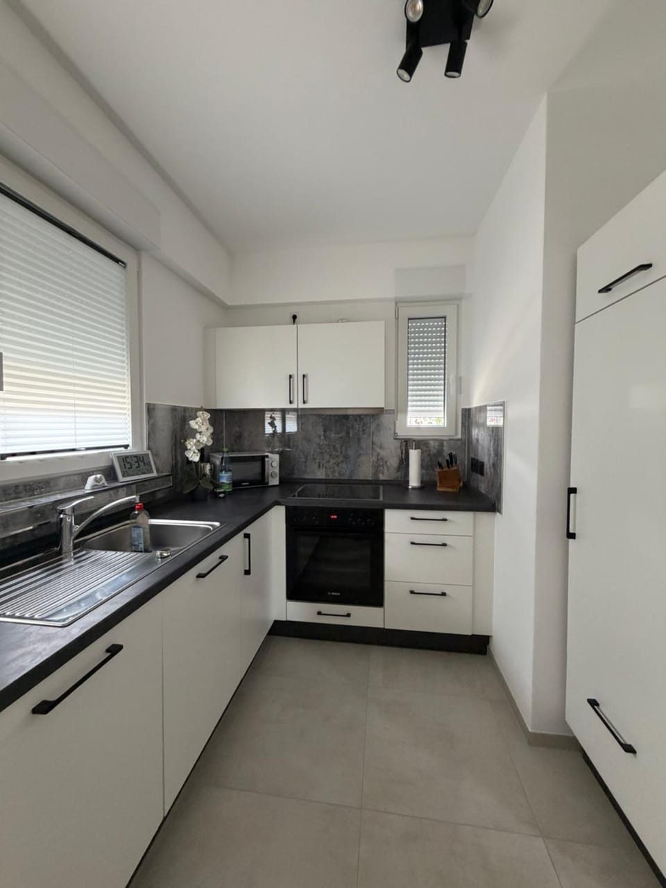 Kitchen or kitchenette, dishwasher, oven, stove