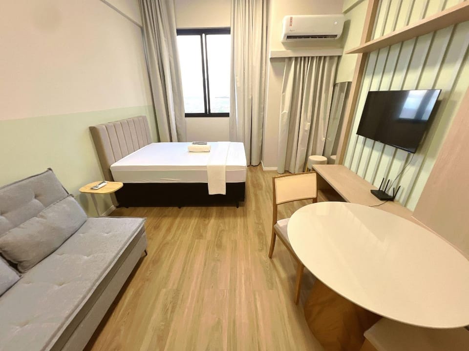 Communal lounge/ TV room, Bed, TV and multimedia, Living room, Photo of the whole room, Seating area, Dining area, Bedroom, air conditioner