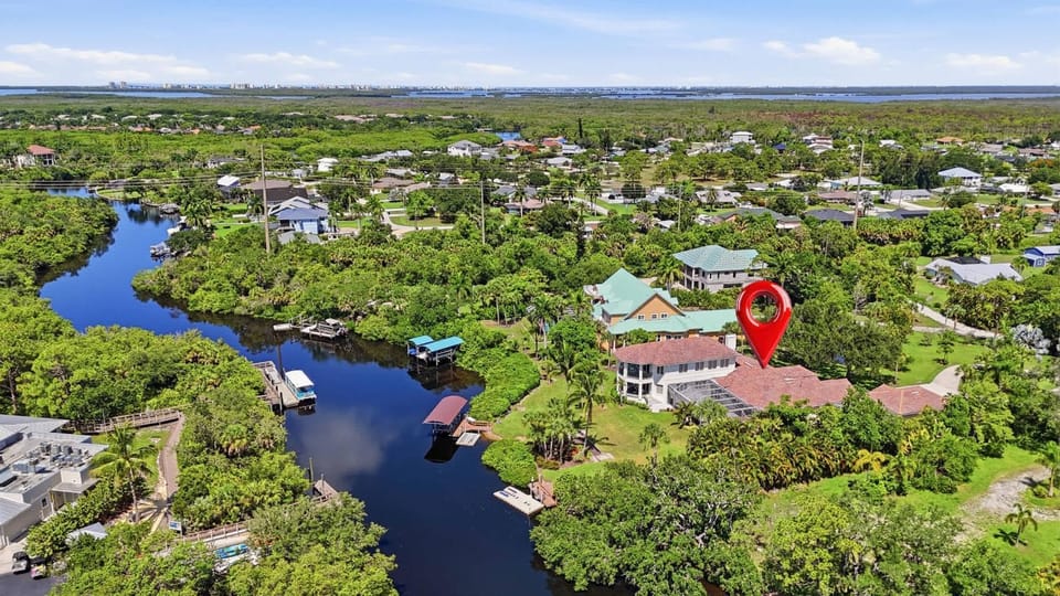 Riverfront Retreat with Pool Spa & Dock House in Estero
