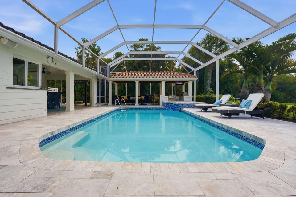 Riverfront Retreat with Pool Spa & Dock House in Estero