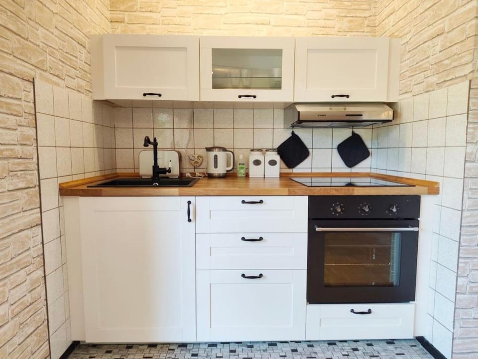 Kitchen or kitchenette, oven, stove, toaster