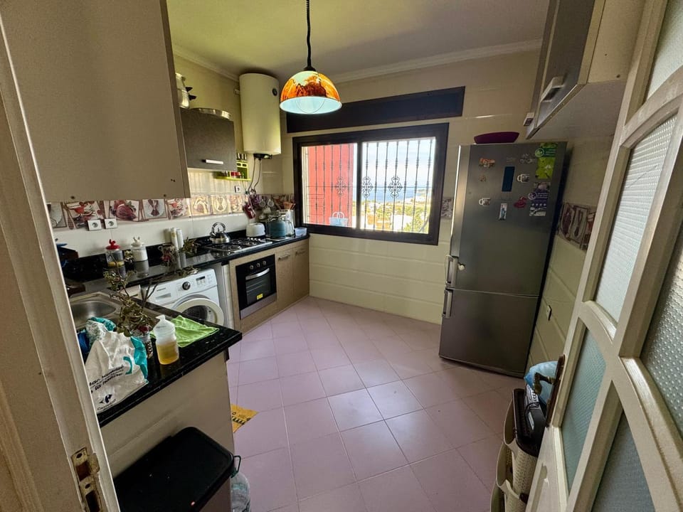Kitchen or kitchenette, dishwasher, oven, stove