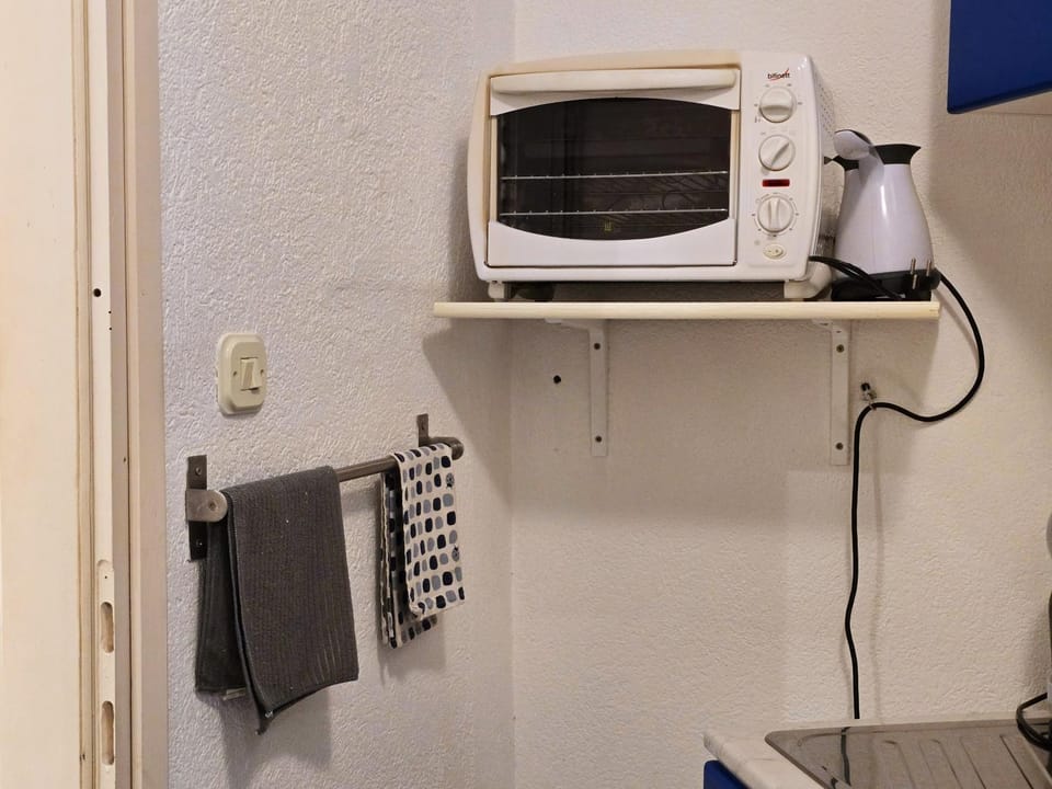 Kitchen or kitchenette, microwave
