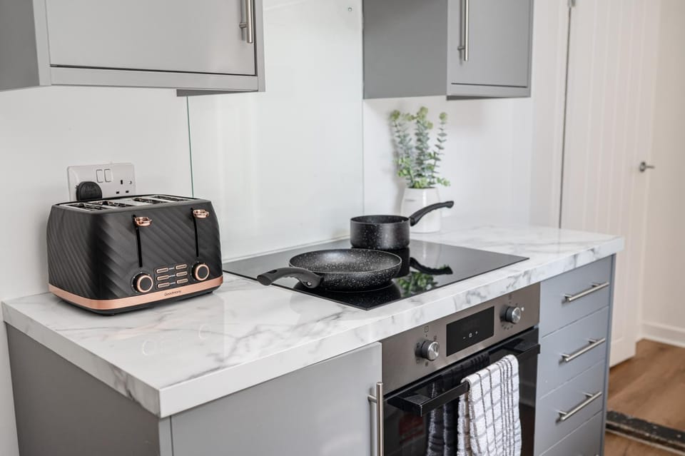 Kitchen or kitchenette, stove, toaster