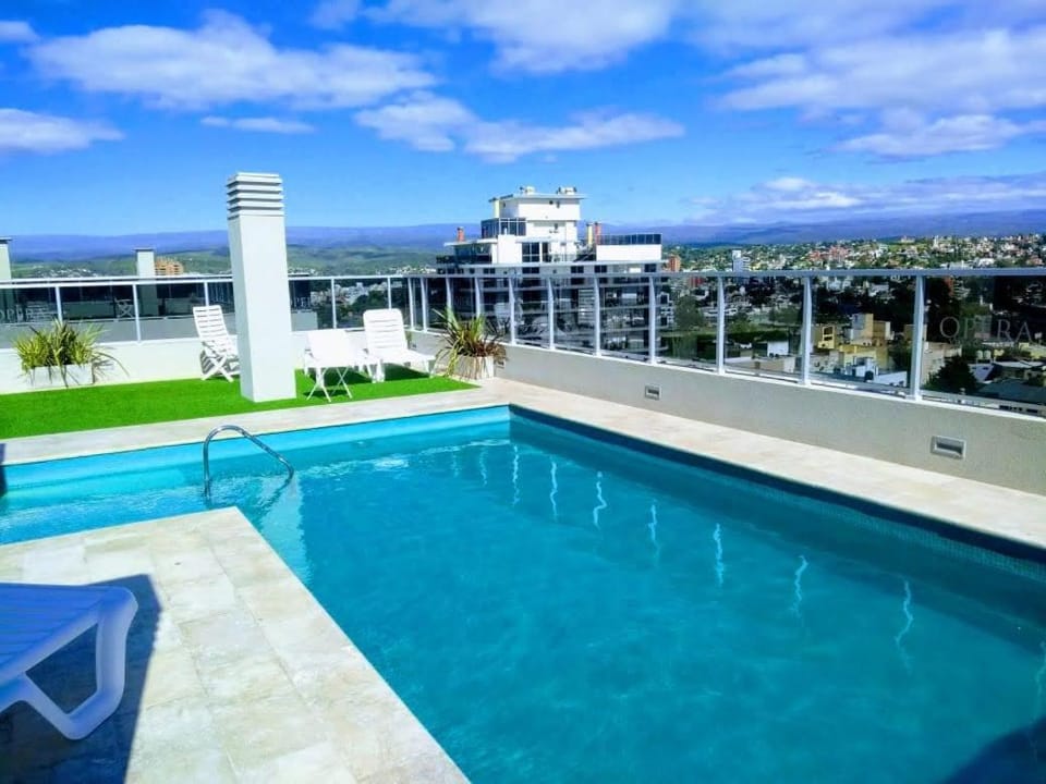 Departamento centrico con cochera para 4 personas con pileta Apartment in Villa Carlos Paz