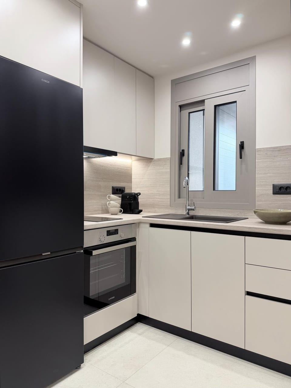 Kitchen or kitchenette, dishwasher, oven, stove