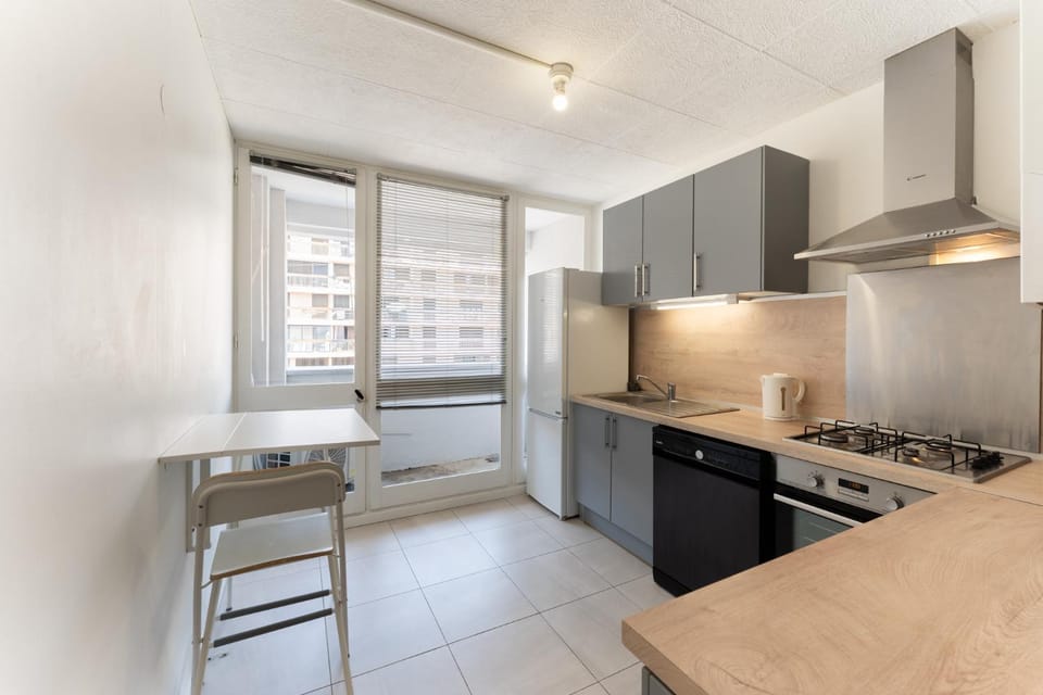 Kitchen or kitchenette, dishwasher, oven, stove