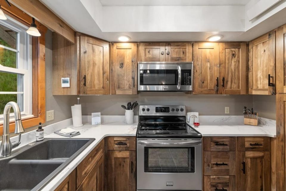 Kitchen or kitchenette, dishwasher, oven, stove, toaster
