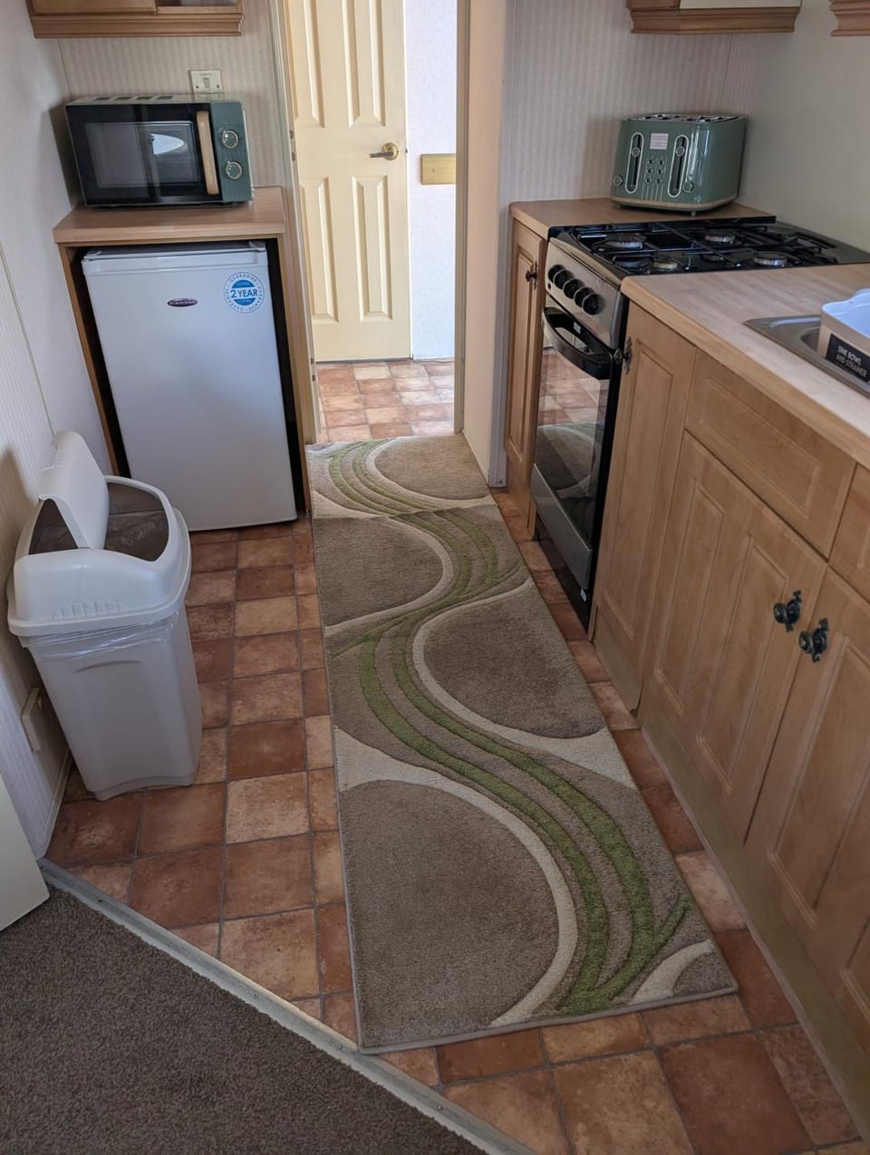Kitchen or kitchenette, oven, toaster