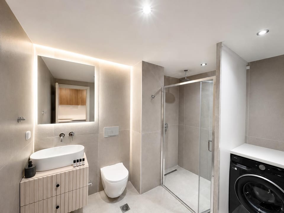 Shower, Toilet, Bathroom, towels, washing machine, dryer