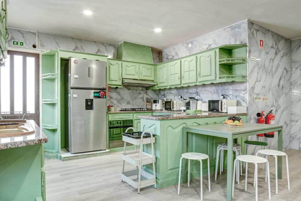Kitchen or kitchenette, dishwasher, oven, stove, toaster