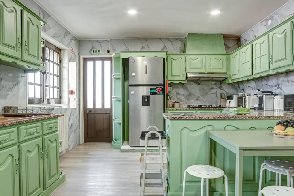 Kitchen or kitchenette, dishwasher, oven, stove, toaster