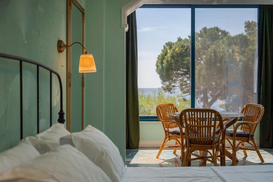 Bed, Natural landscape, View (from property/room), Living room, Seating area, Bedroom