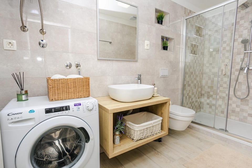 Shower, Toilet, Bathroom, towels, washing machine, dryer