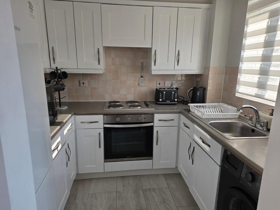 Kitchen or kitchenette, stove, toaster