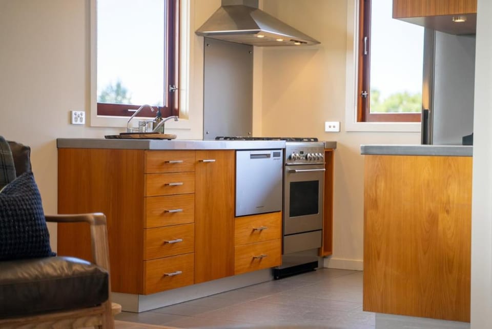 Kitchen or kitchenette, dishwasher, oven, stove