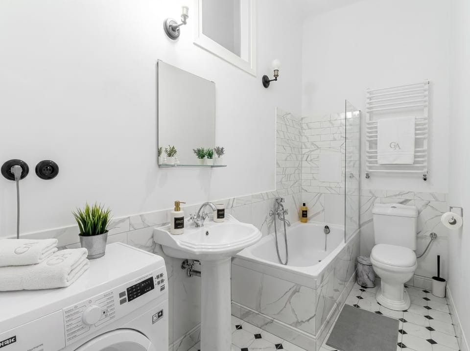 Shower, Toilet, Bathroom, Bath, bidet, towels, washing machine, dryer