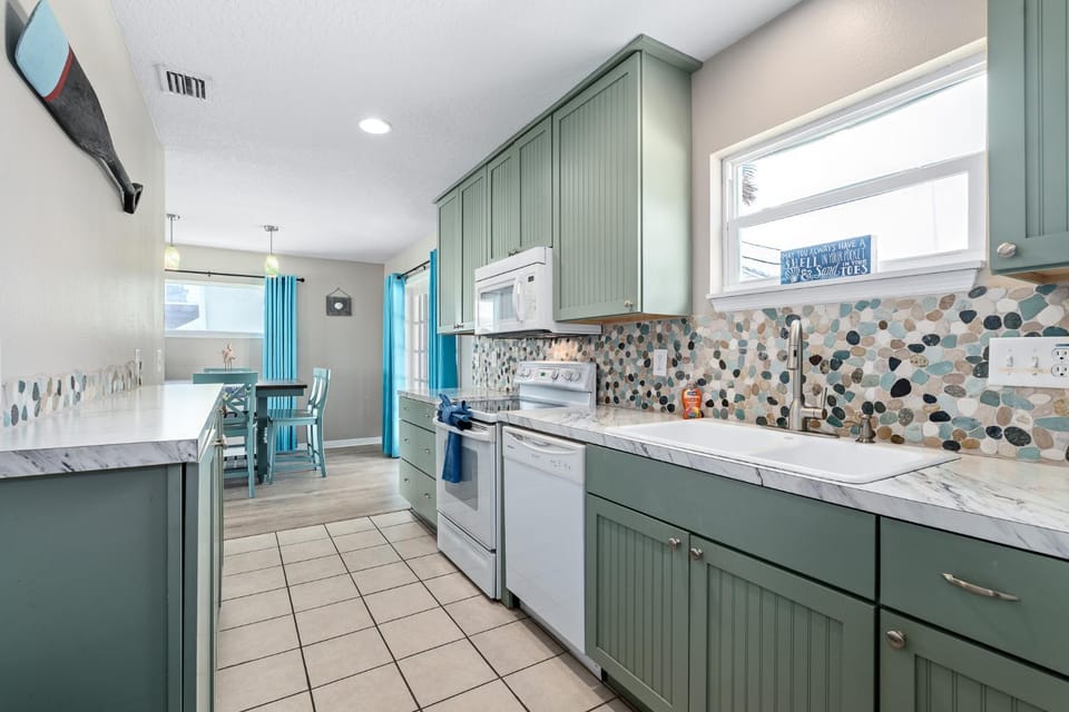 Kitchen or kitchenette, dishwasher, oven, stove