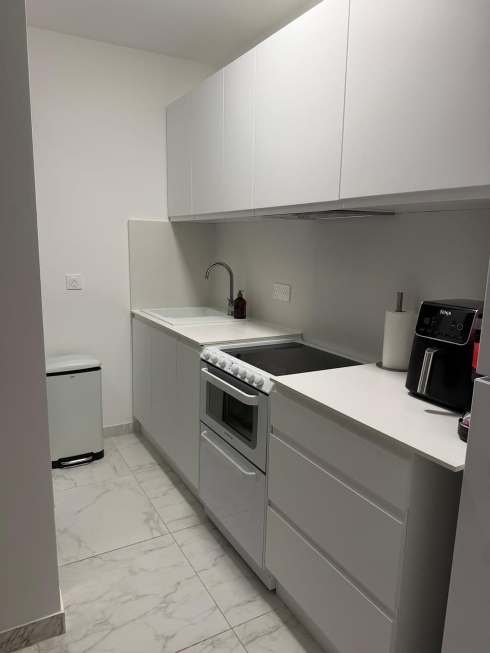 Kitchen or kitchenette, dishwasher, oven, stove, toaster