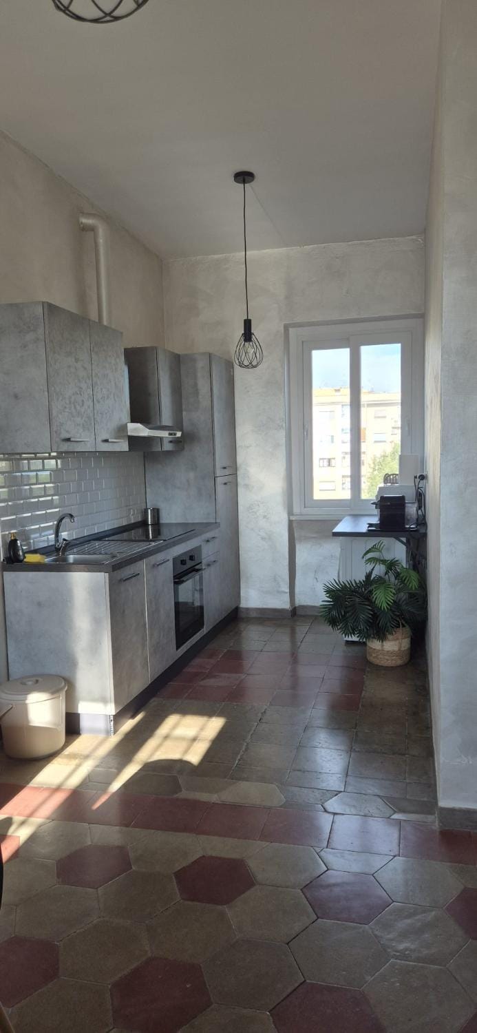 Kitchen or kitchenette, dishwasher, oven, stove