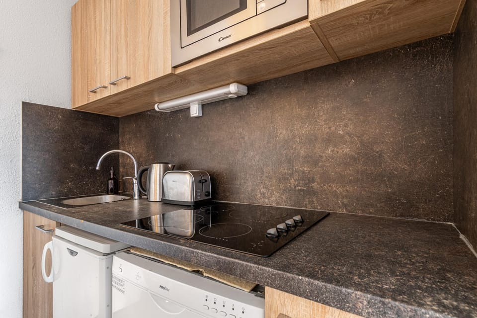 Kitchen or kitchenette, stove, toaster