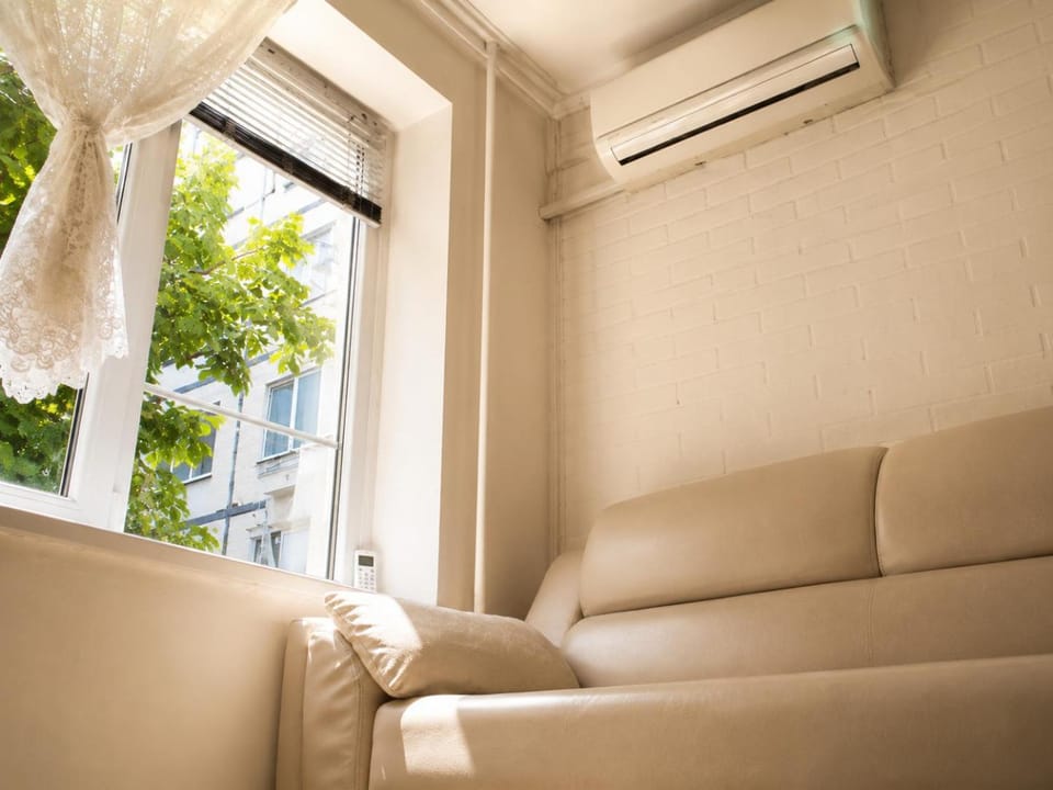 View (from property/room), Living room, Seating area, Garden view, air conditioner