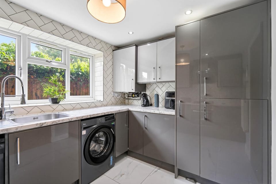 Kitchen or kitchenette, dishwasher, oven, stove, toaster, washing machine