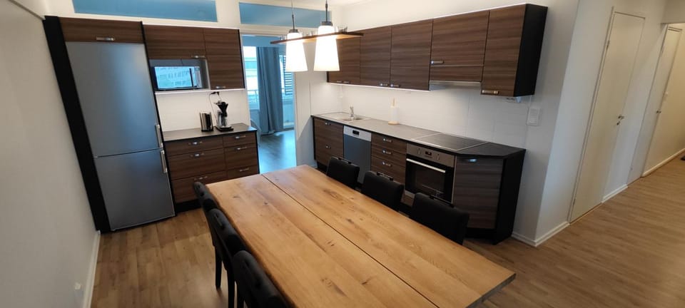Kitchen or kitchenette, dishwasher, oven, stove