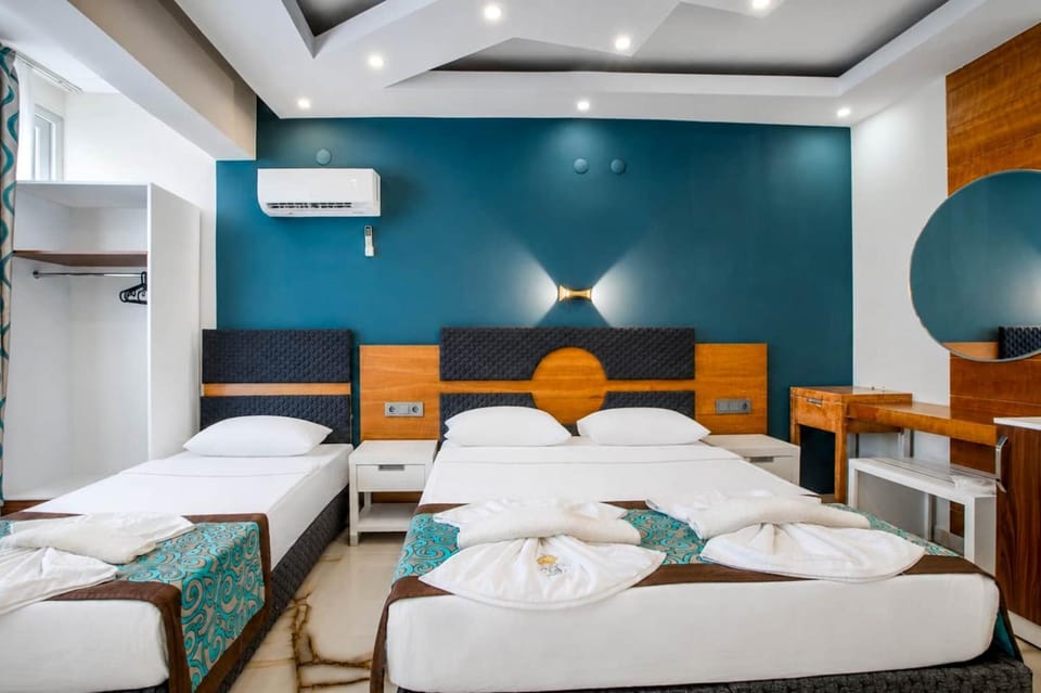 Photo of the whole room, towels, air conditioner