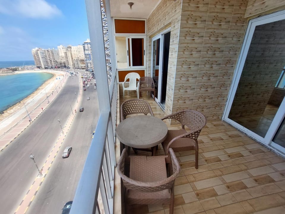 View (from property/room), Balcony/Terrace, Seating area, Beach, Sea view
