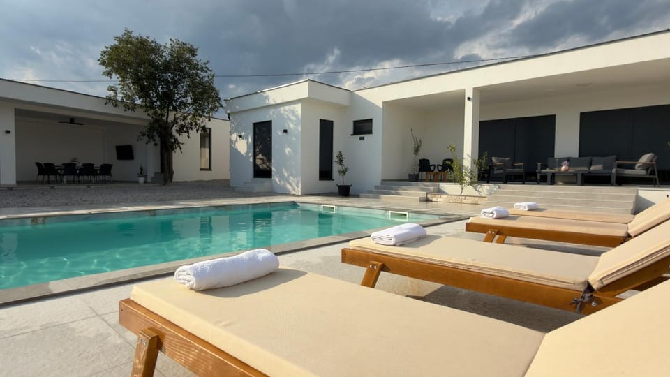 Patio, Day, Natural landscape, Seating area, Pool view, Swimming pool, sunbed