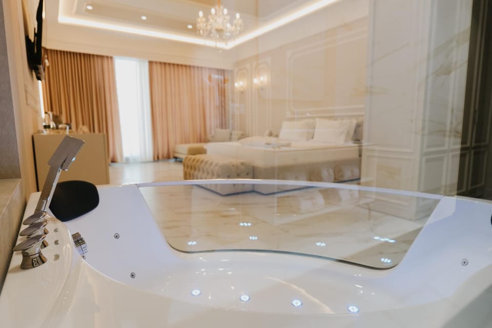 Bed, Hot Tub, Bathroom, Living room, Photo of the whole room, Seating area, Bedroom, Bath