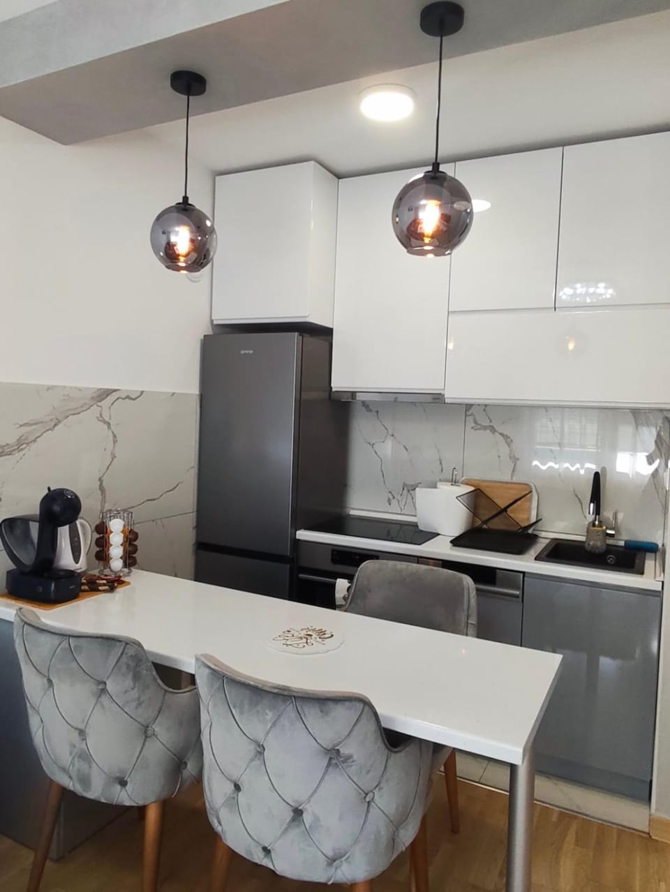 Kitchen or kitchenette, dishwasher, oven, stove