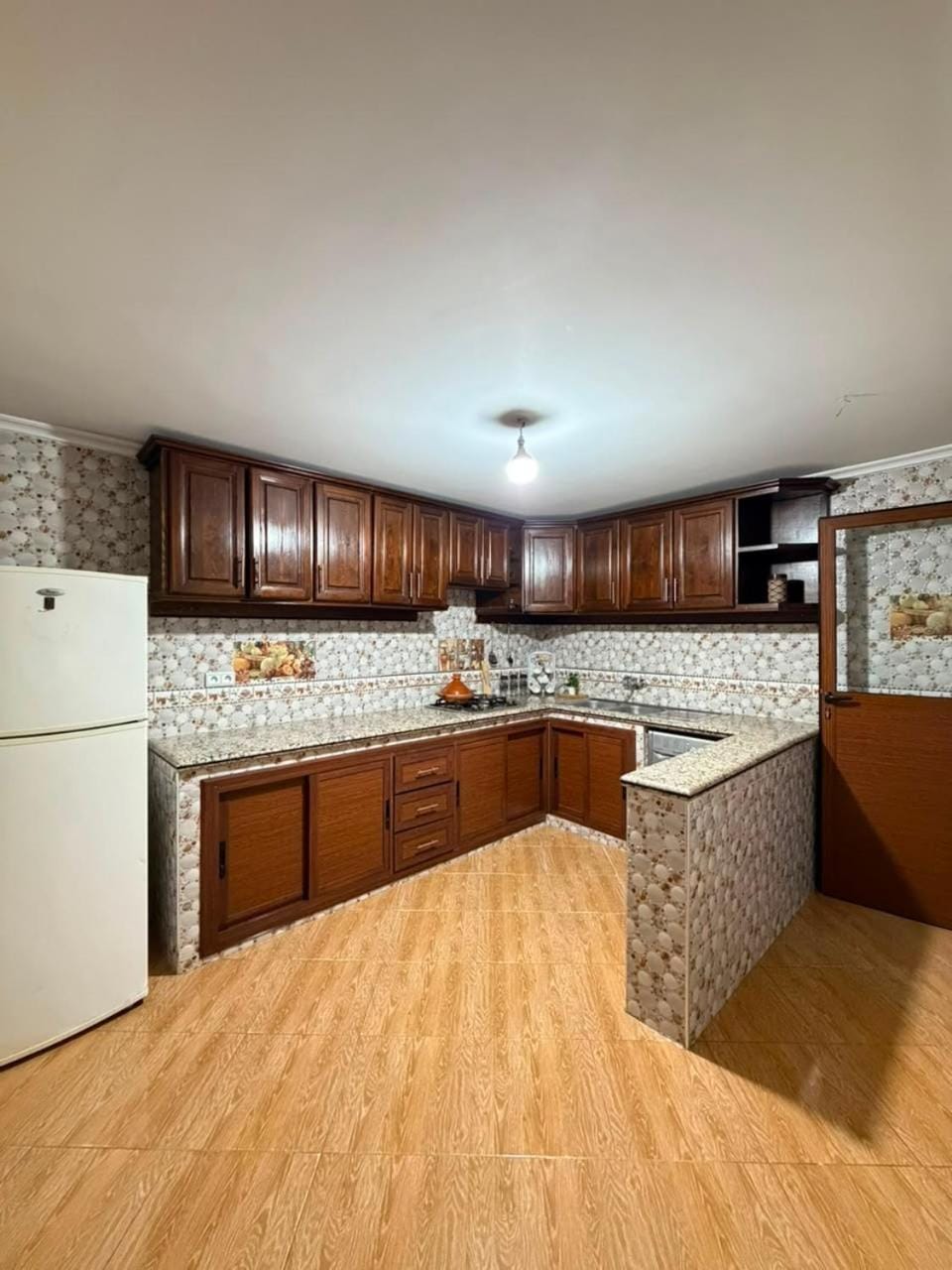 Kitchen or kitchenette, stove, washing machine