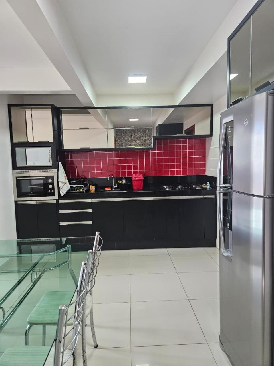 Kitchen or kitchenette, microwave, oven, stove