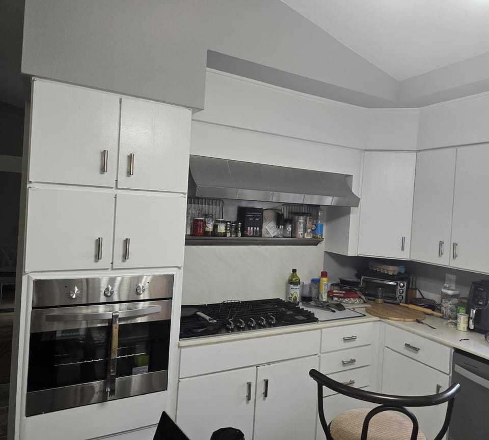 Kitchen or kitchenette, dishwasher, oven, stove, toaster