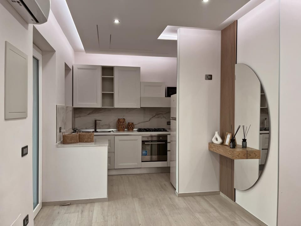 Kitchen or kitchenette, dishwasher, oven, stove