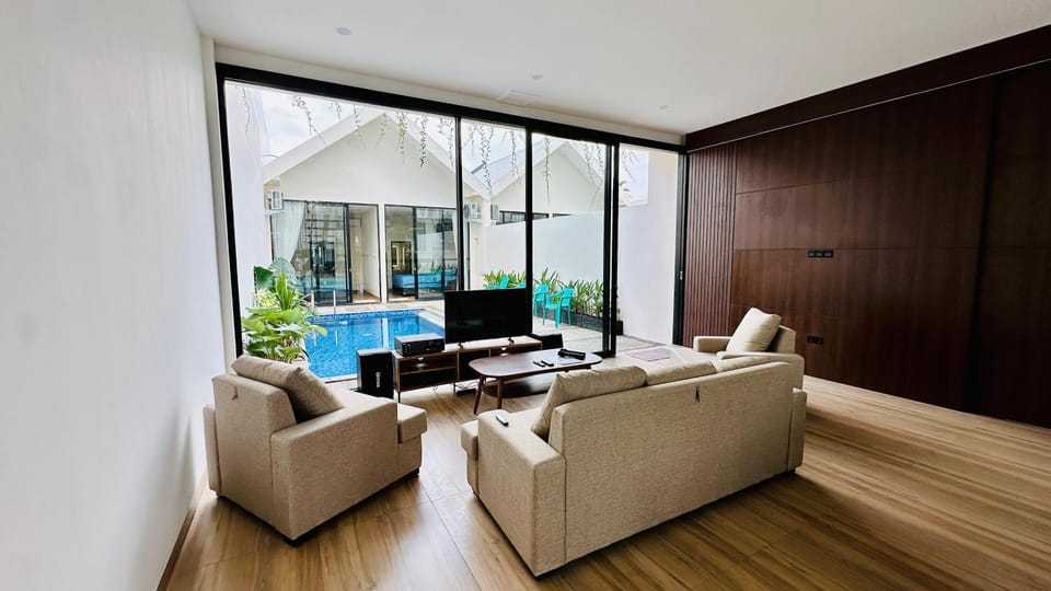 Living room, Seating area, Pool view