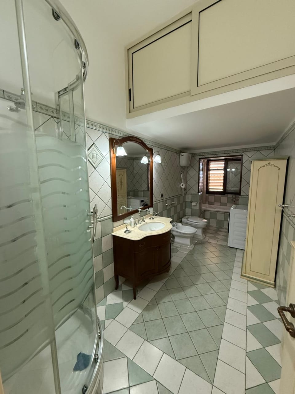 Shower, Toilet, Bathroom, Bath, bidet, hair dryier, towels, washing machine