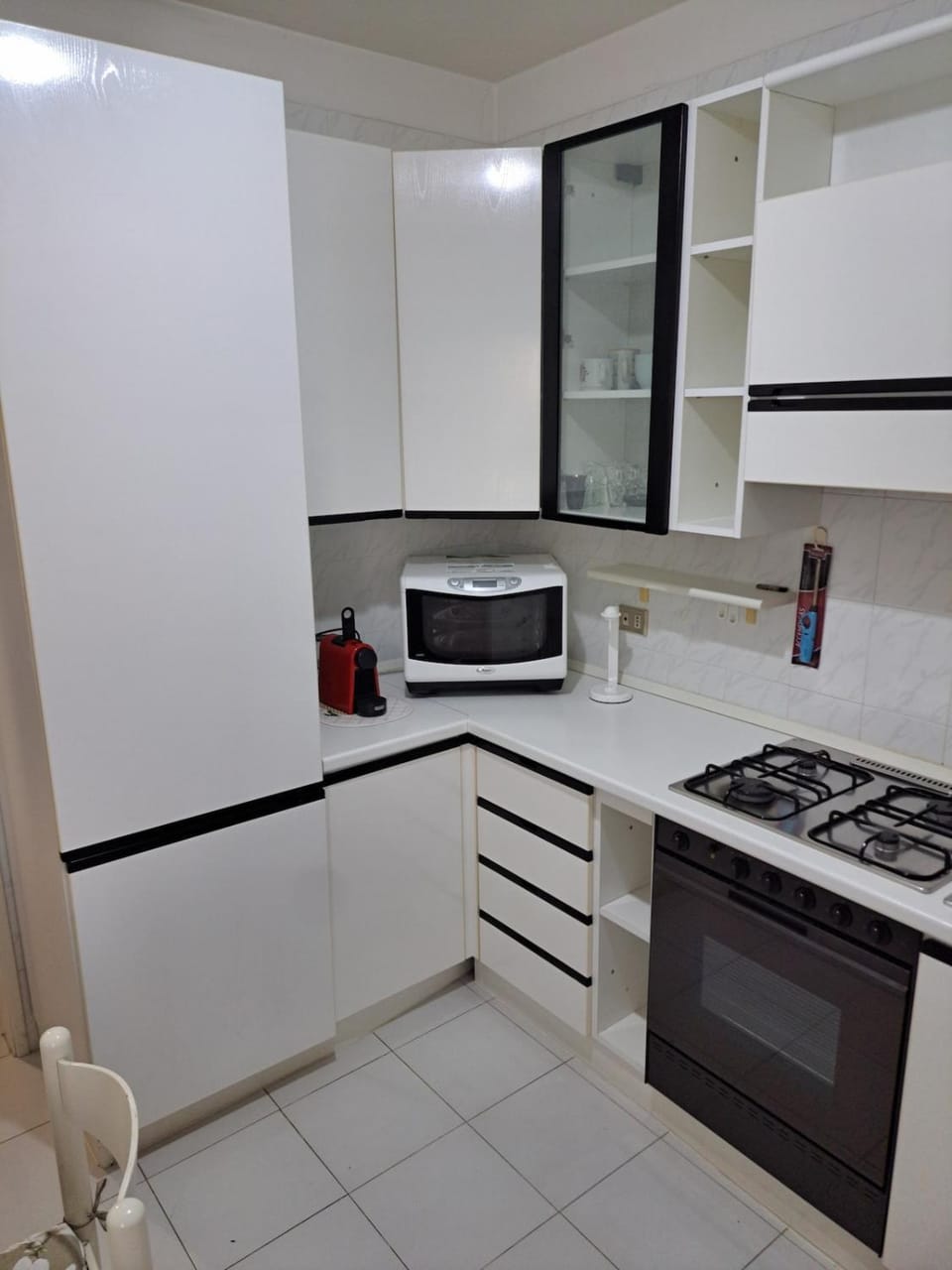 Kitchen or kitchenette, dishwasher, oven, stove, toaster