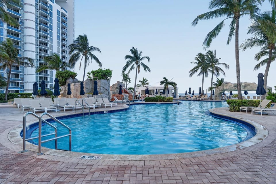Property building, Pool view, Swimming pool, sunbed