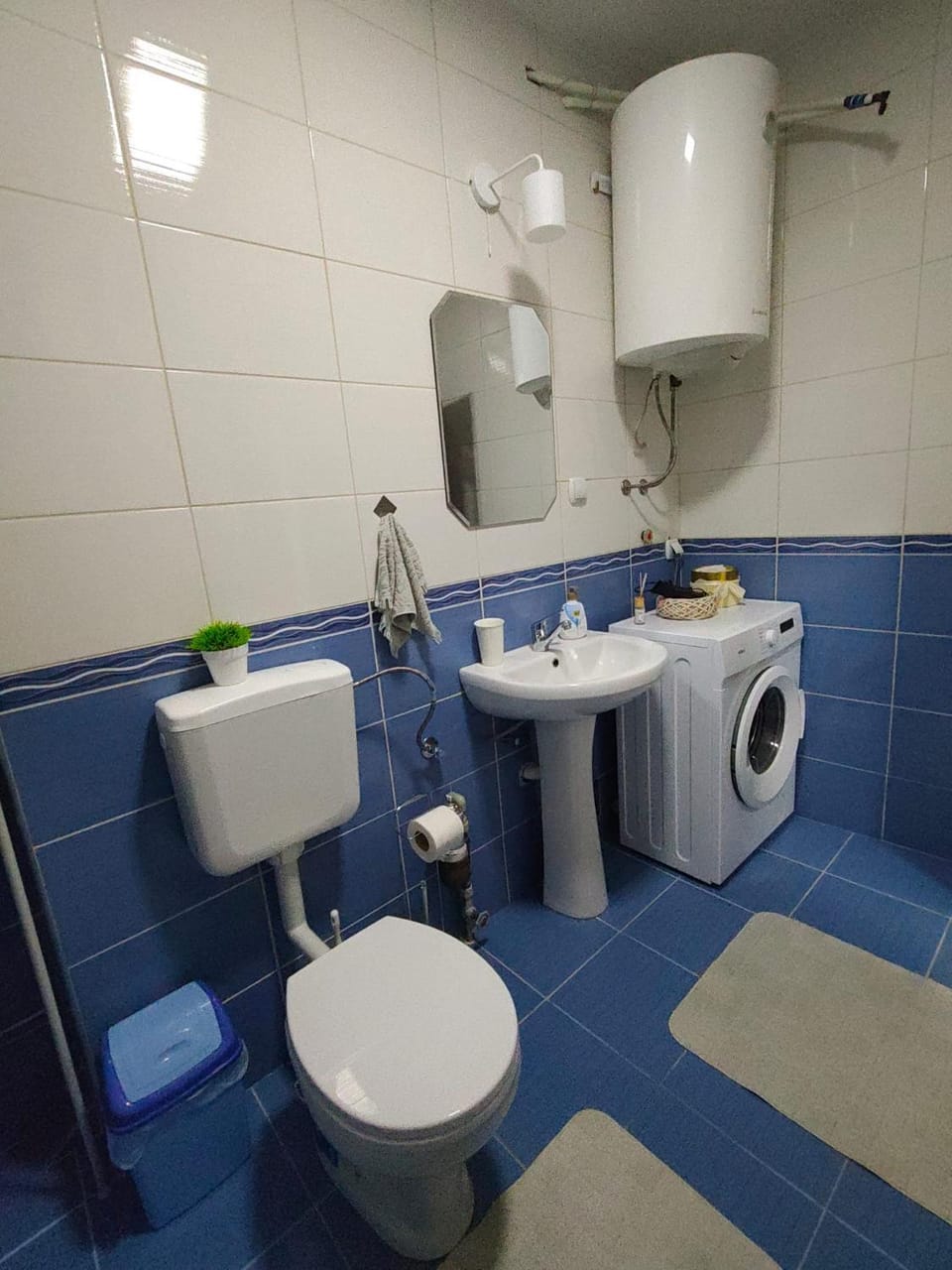Toilet, Bathroom, bidet, towels, washing machine, dryer