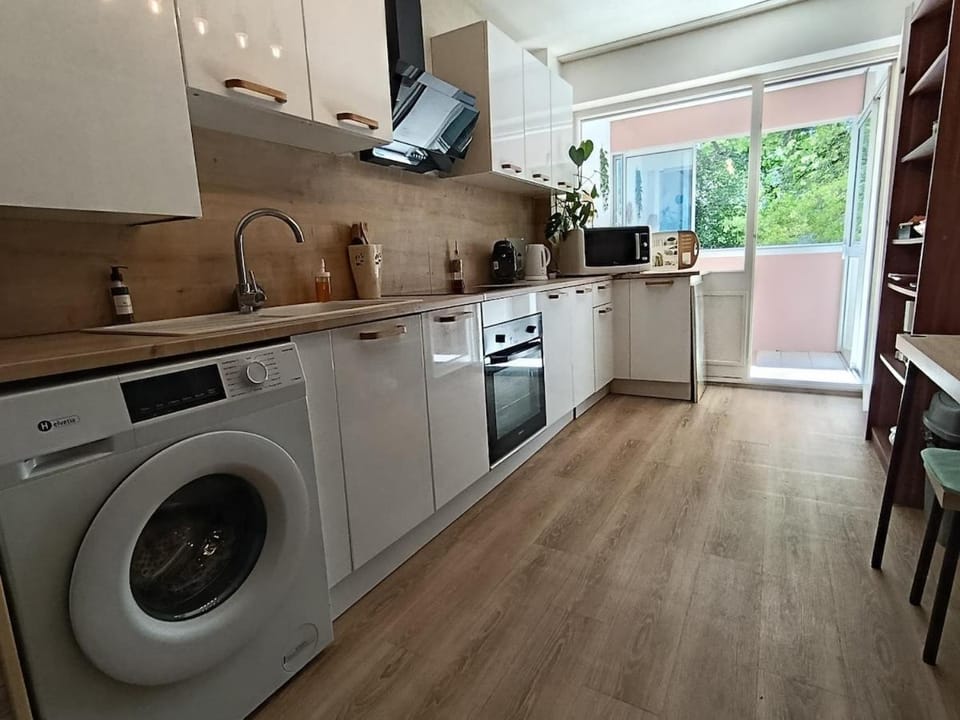 Kitchen or kitchenette, oven, stove, toaster, washing machine