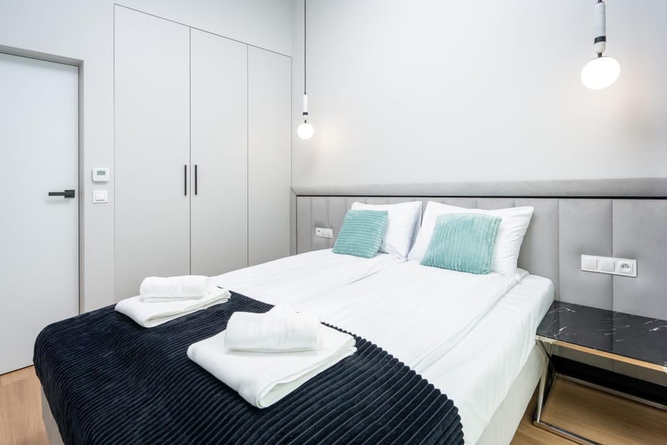 Bed, Seating area, Bedroom, towels, wardrobe