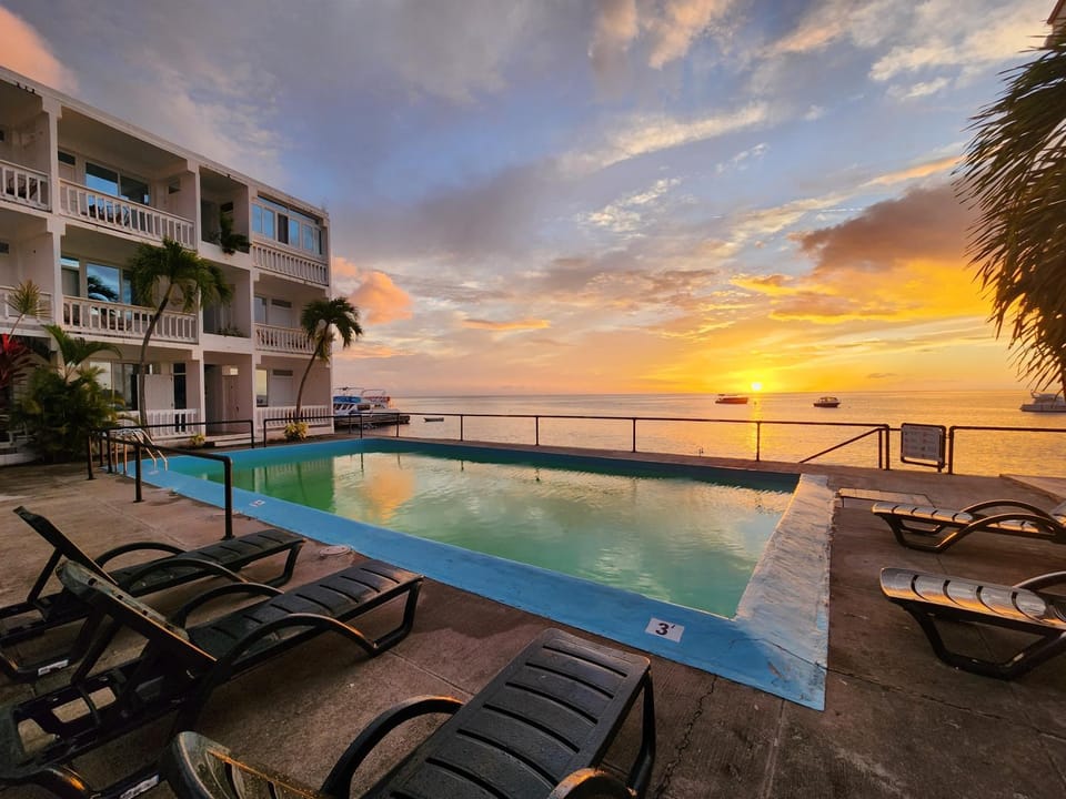 Property building, Swimming pool, Sunset