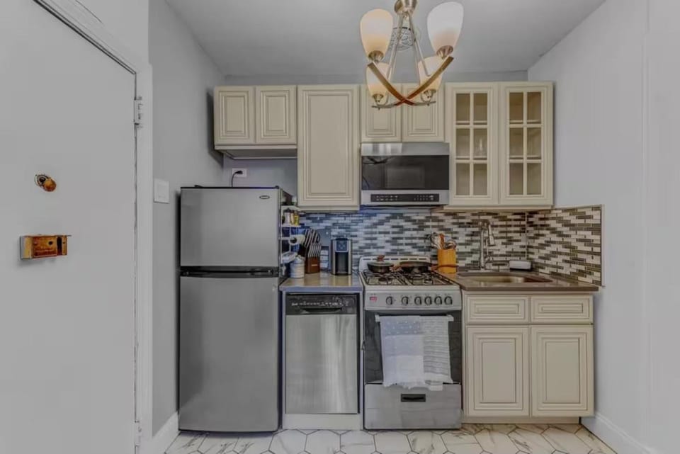 Kitchen or kitchenette, dishwasher, oven, stove