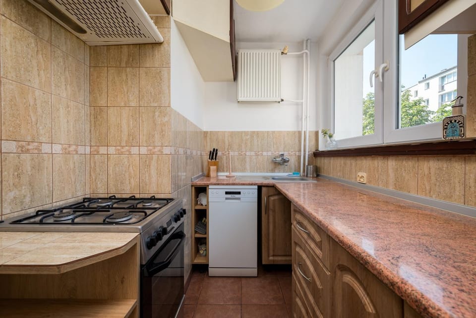 Kitchen or kitchenette, dishwasher, oven, stove