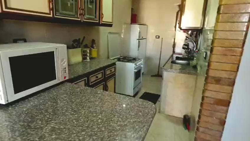 Kitchen or kitchenette, oven