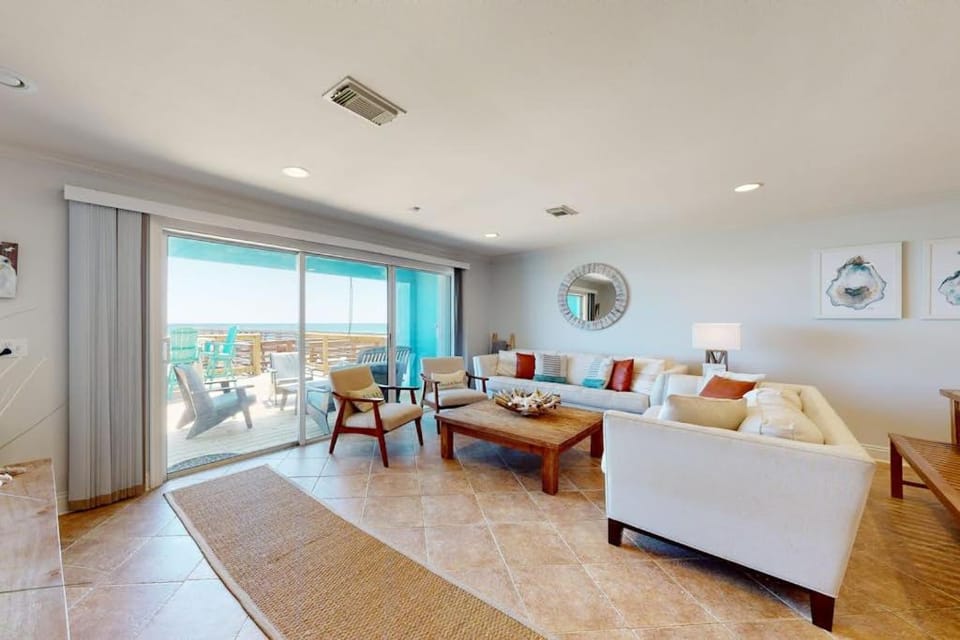 Three-Story Beachfront Gem with a Private Balcony Ocean View & Full Kitchen House in Pensacola Beach