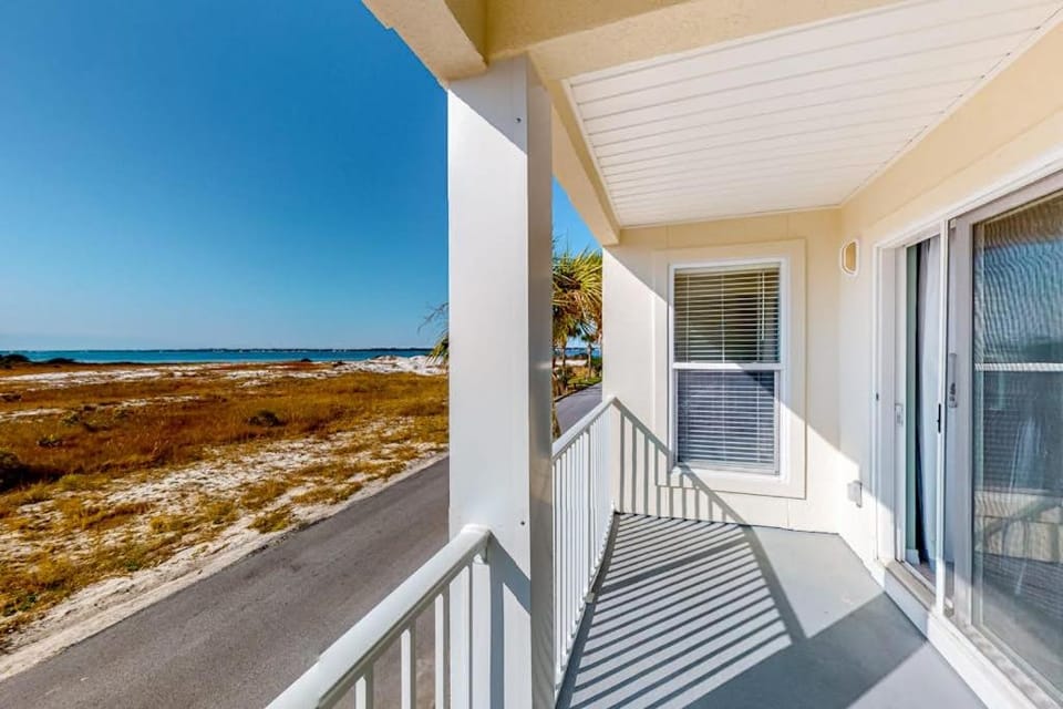 Sunny coastal condo with pool balcony & sound view - walk to the beach House in Pensacola Beach